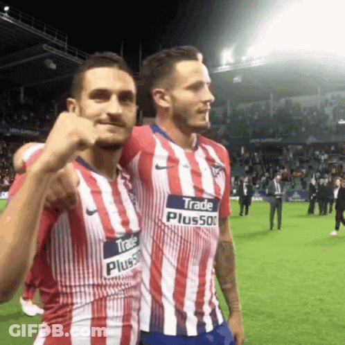 Two Soccer Players In Red White Blue Striped Jerseys With Trade Plus500 GIF