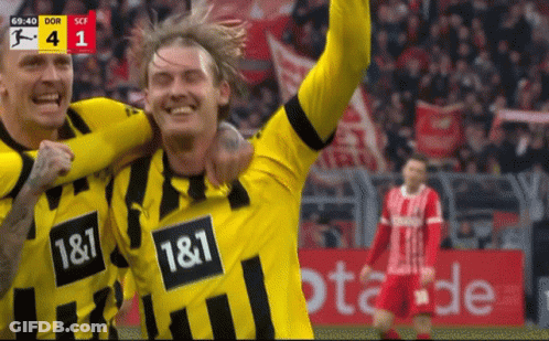 Two Soccer Players In Yellow And Black Jerseys 1 & 1 GIF