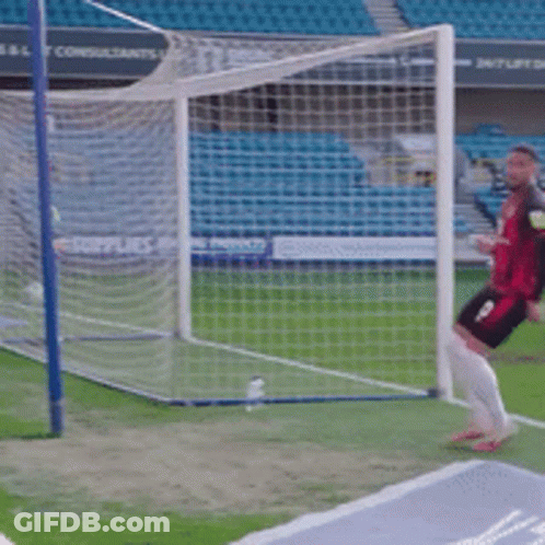 Two Soccer Players In Yellow Jerseys GIF