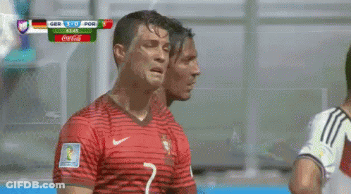 Two Soccer Players Next To Coca Cola Scoreboard GIF