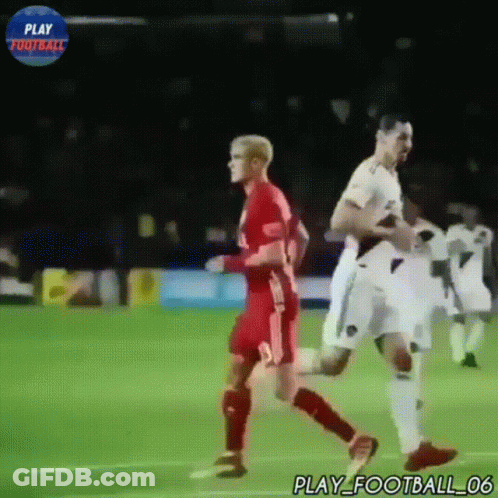 Two Soccer Players On A Field With A Play Football Logo In The Background GIF