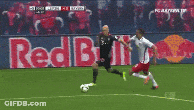 Two Soccer Players On A Field With A Red Bull Ad In The Background GIF