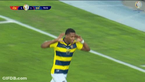 Two Soccer Players On A Field With A Scoreboard That Says Ecu At The Top GIF