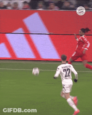 Two Soccer Players On A Field With A Sign That Says Allianz In The Background GIF