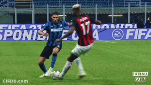 Two Soccer Players On A Field With Ea Sports Advertisements In The Background GIF