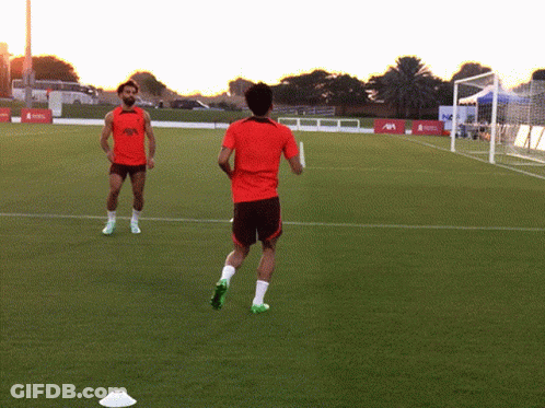 Two Soccer Players On A Field With One Wearing A Shirt That Says ' Allianz ' GIF