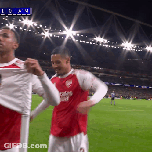 Two Soccer Players On A Field With The Number 10 At The Top GIF