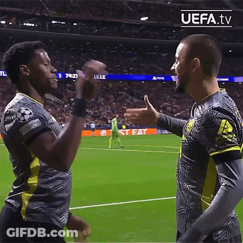 Two Soccer Players On A Field With Uefa.tv Written On The Bottom Right GIF