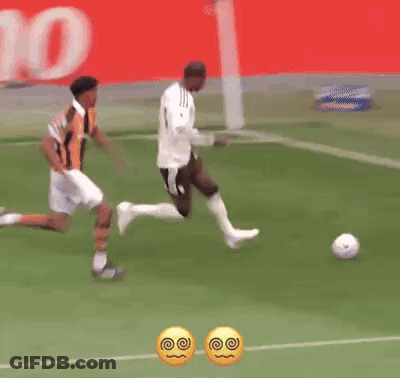Two Soccer Players On Field With Betano Banner GIF