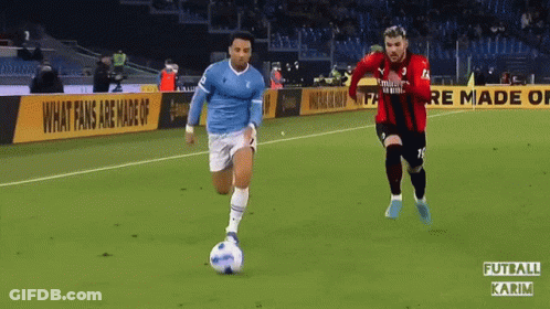 Two Soccer Players On Field With Binance Banner GIF