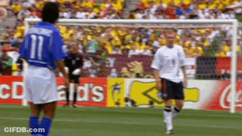 Two Soccer Players On Field With McDonald's Sign GIF