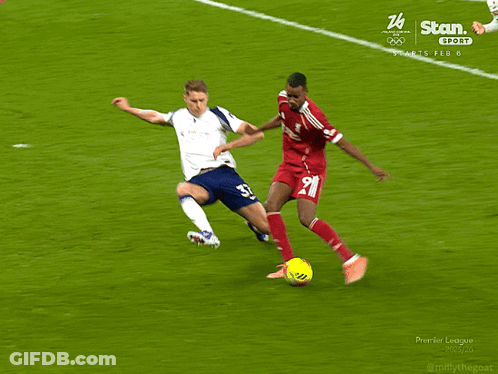 Two Soccer Players On Field With Number 26 GIF