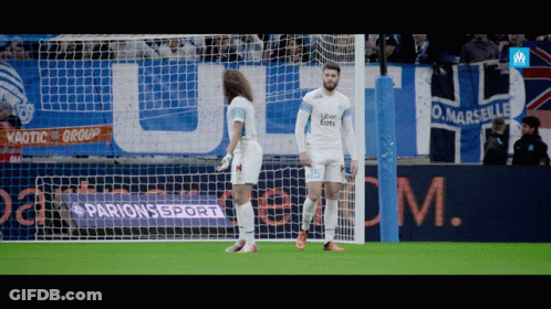 Two Soccer Players On Field With Parions Sport Banner GIF