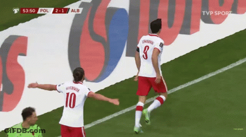 Two Soccer Players On Field With TVP Sport Banner GIF