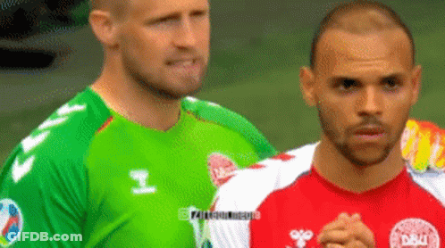 Two Soccer Players One In A Green Jersey And One In A Red Jersey GIF