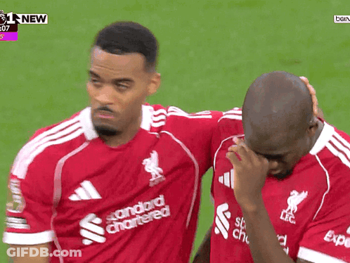 Two Soccer Players One In Red Standard Chartered Shirt GIF