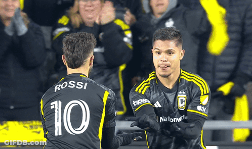 Two Soccer Players One Of Whom Has The Number 10 On Their Jersey GIF