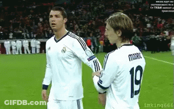 Two Soccer Players One Of Whom Has The Number 19 On Their Jersey GIF