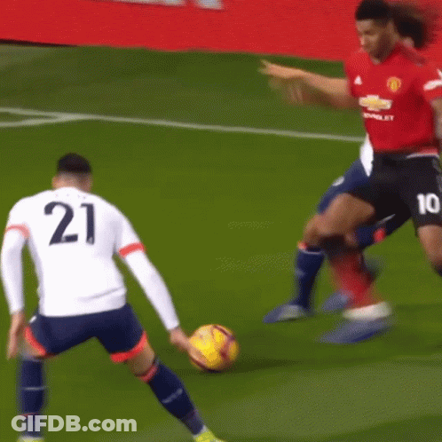 Two Soccer Players One Of Whom Has The Number 21 On Their Jersey GIF