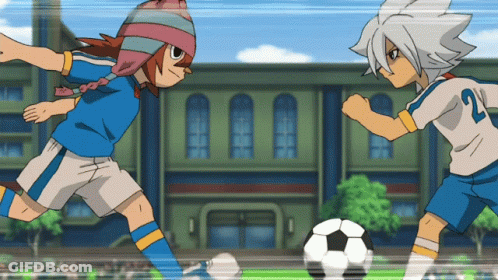 Two Soccer Players One Of Whom Has The Number 21 On Their Jersey GIF