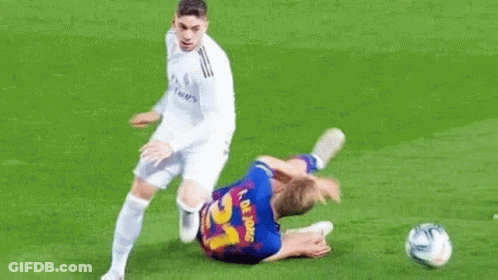 Two Soccer Players Playing Field One Lying GIF