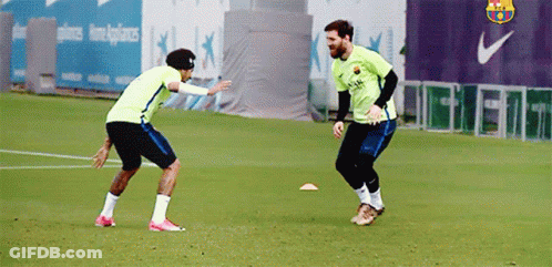 Two Soccer Players Playing Near Nike Logo GIF