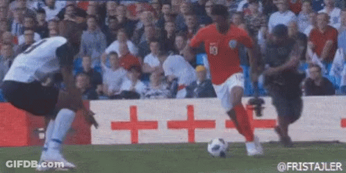 Two Soccer Players Playing On Field With Crowd GIF