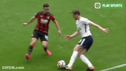 Two Soccer Players Playing Soccer On Field GIF
