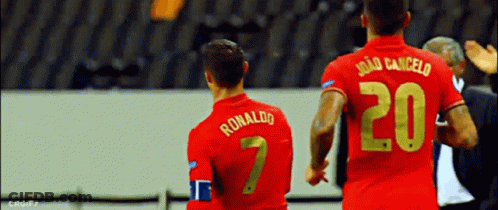 Two Soccer Players Ronaldo And Joao Cancelo GIF