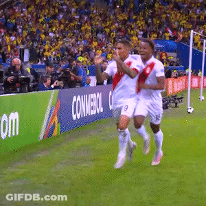 Two Soccer Players Running On A Field With A Conmebol Banner In The Background GIF