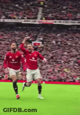 Two Soccer Players Running With Arms Up GIF