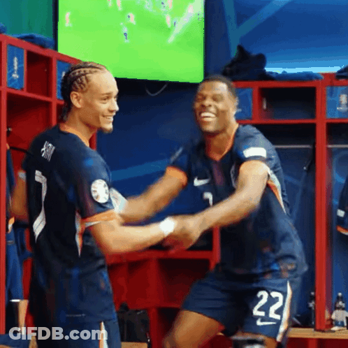 Two Soccer Players Shaking Hands In Locker Room GIF