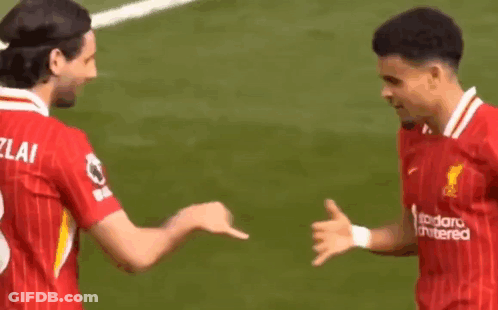 Two Soccer Players Shaking Hands On Field GIF