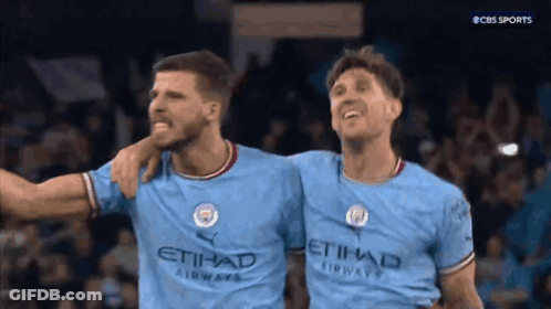Two Soccer Players Standing Next To Each Other GIF