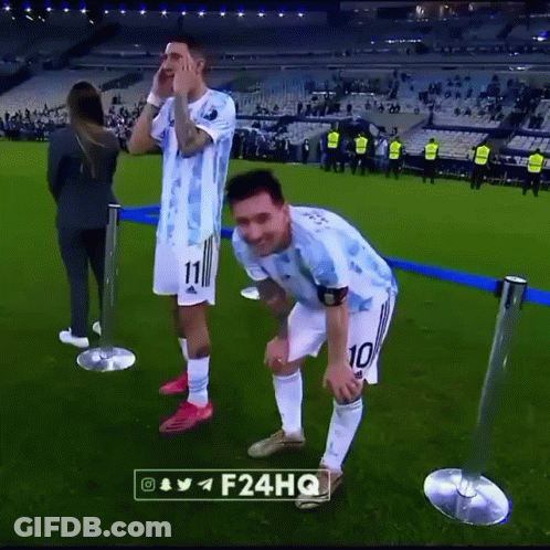 Two Soccer Players Standing On Field GIF