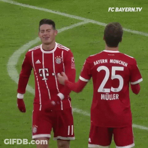 Two Soccer Players Standing Together GIF