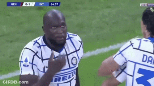 Two Soccer Players Talking On Field GIF