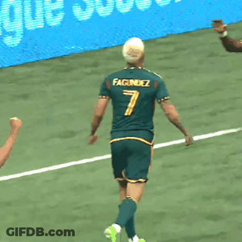 Two Soccer Players Wearing Green Jerseys With The Number 7 And 28 On Them GIF