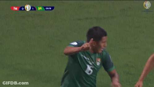 Two Soccer Players Wearing Marathon Jerseys Are Running On The Field GIF