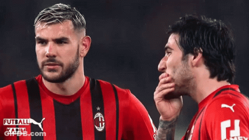 Two Soccer Players Wearing Red And Black Striped Shirts With Karim Written On Them GIF