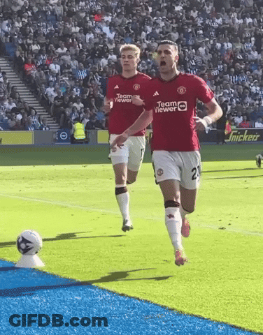Two Soccer Players Wearing Red Jerseys That Say Teamviewer GIF