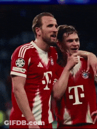 Two Soccer Players Wearing Red T-Mobile Jerseys Are Hugging GIF