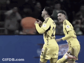 Two Soccer Players Wearing Yellow Jerseys One With The Number 2 On It GIF