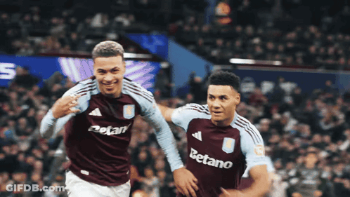 Two Soccer Players With Betano On Their Shirts GIF