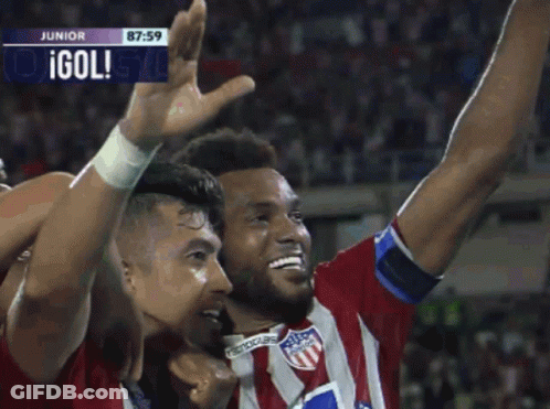 Two Soccer Players With Olympica On Their Shirts Are Celebrating A Goal GIF