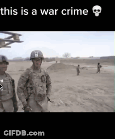 Two Soldiers Are Standing In A Field With The Words This Is A War Crime GIF