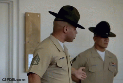 Two Soldiers Are Standing Next To Each Other And One Has A Name Tag That Says ' Smith ' On It GIF