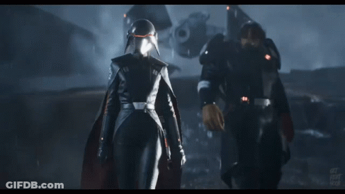 Two Soldiers Are Standing Next To Each Other And One Of Them Is Wearing A Helmet With The Letters Jdp On It GIF
