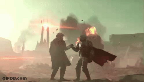 Two Soldiers Are Standing Next To Each Other In Front Of A Burning City . GIF