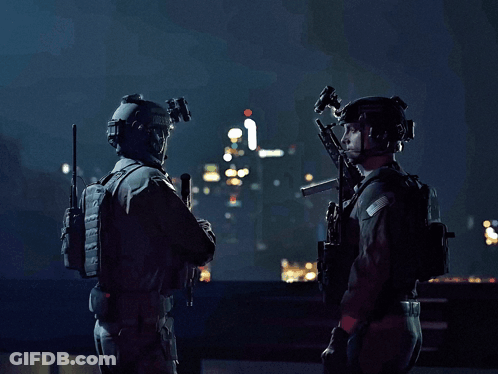 Two Soldiers Are Standing Next To Each Other With Guns In Their Hands GIF
